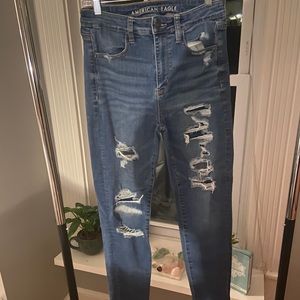 Ripped American Eagle blue jeans.
